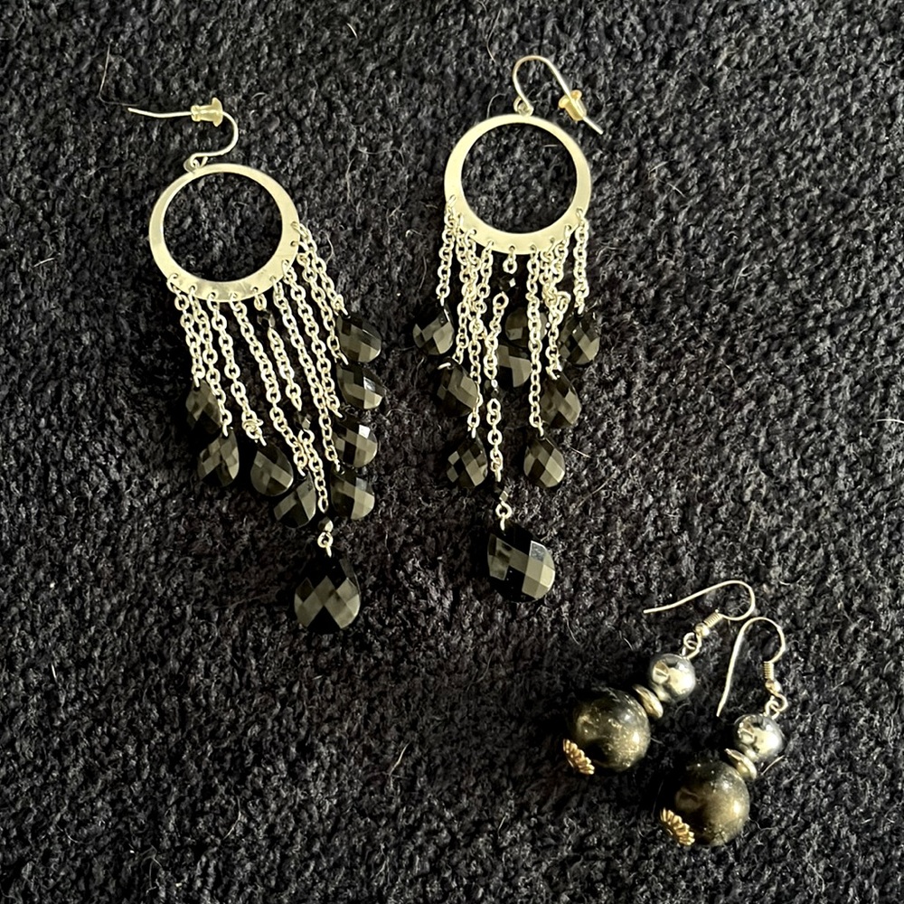 two pairs of costume jewelry earrings - silver and black